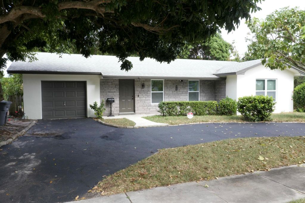 Photo of 425 Greenbriar Drive, Lake Park, FL 33403 (MLS # R11049297)
