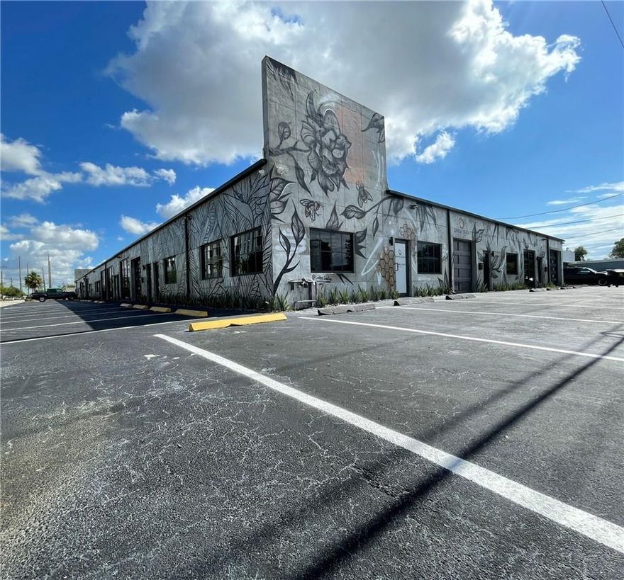 Newly renovated industrial bay currently operating as a gym. With lots of natural light, an open floor plan, and a bay door, this space would work well for industrial or creative users. The current tenant mix includes a wide array of concepts, such as a car detailer, a brewery, a photo study, a ghost kitchen, an apparel manufacturer, a music studio, and a Chamber of Commerce.

The owners have made several recent investments to the property, including glazing, glass roll-up doors, stucco, roof repair, and award-winning mural art.
Surrounding area is vibrant, with notable landmarks like Oakland Park's Downtown Core and Central Business District. Over the next two years, 1,000 new residential units will be delivered within a one-mile radius, promising a steadily increasing customer base.