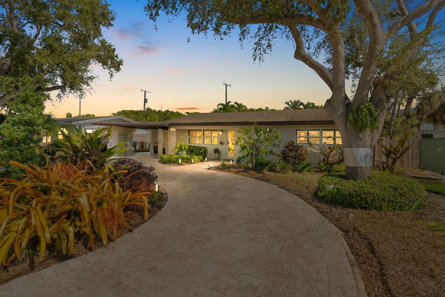 Beautiful, updated 3-bedroom, 3-bath home located in Coral Heights, Oakland Park.  Open floor plan encompasses Chef’s kitchen with granite counter tops, SS appliances, island, gas stove and dinette offering views of landscaped back yard and heated pool; pool deck, walkways, driveway, and car port are ivory travertine tile.  Large living area.  Two split primary suites with walk-in closets and spa-style bathrooms (main primary with double shower/sinks). High ceilings, polished porcelain (ceramic) tile floors, and crown molding throughout; bedrooms are carpeted. Additional highlights: gas dryer, tankless water heater, impact doors & windows, large circular driveway w/ covered carport, camera system, front/back exterior outlets.  Property resides on Holy Cross Hospital power grid.