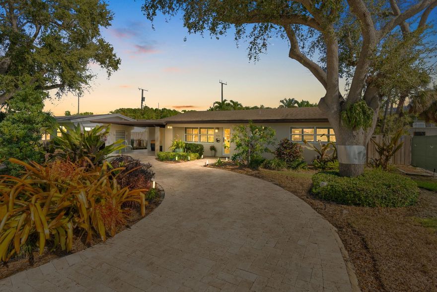 Beautiful, updated 3-bedroom, 3-bath home located in Coral Heights, Oakland Park.  Open floor plan encompasses Chef’s kitchen with granite counter tops, SS appliances, island, gas stove and dinette offering views of landscaped back yard and heated pool; pool deck, walkways, driveway, and car port are ivory travertine tile.  Large living area.  Two split primary suites with walk-in closets and spa-style bathrooms (main primary with double shower/sinks). High ceilings, polished porcelain (ceramic) tile floors, and crown molding throughout; bedrooms are carpeted. Additional highlights: gas dryer, tankless water heater, impact doors & windows, large circular driveway w/ covered carport, camera system, front/back exterior outlets.  Property resides on Holy Cross Hospital power grid.