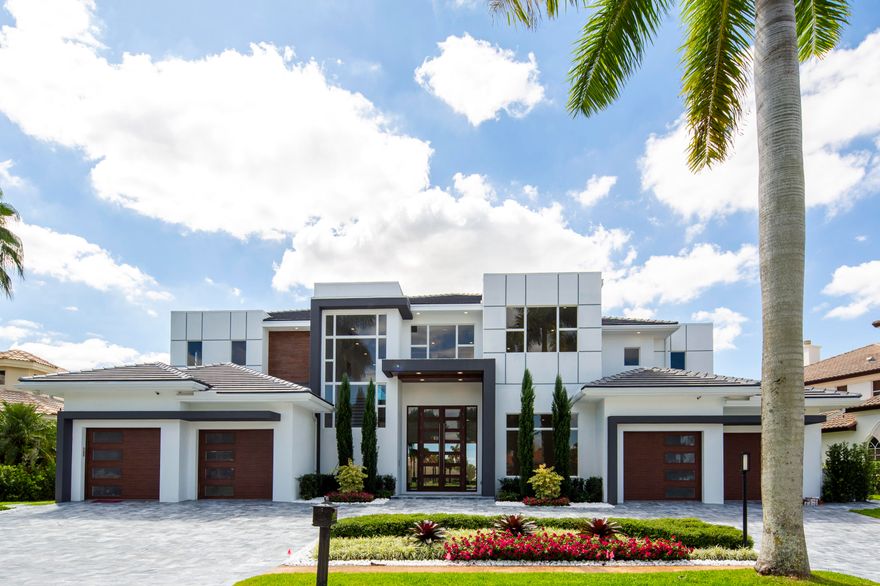 ONLY NEW CONSTRUCTION PROPERTY WITH LAKE VIEW!!! $585,000 PRICE REDUCTION. MOTIVATED SELLER. 
Distinguished by spectacular exterior and interior architectural elements, this prestigious contemporary residence features 6 bedrooms, 7 full baths, 2 half baths and approximately 7,257 sq ft of air conditioned living space. The first floor includes a formal living room, formal dining room, a gourmet chef's kitchen with state of the art appliances, breakfast room, large family room all designed for effortless entertaining or casual living. The master wing includes a grand master suite with luxurious his and her marble baths, including a steam shower in his bath and generous closets. An office and maid's room complete the downstairs level. 4 ensuite bedrooms, a large game lounge, and media room complete the upstairs. The lushly landscaped property features a dramatic resort styled pool and spa, covered loggia with summer kitchen, and breathtaking lake vistas and golf course views. Other features include hurricane resistant windows and doors, full house generator, elevator, and 4 car garage. 

This home is designed to exceed the high wind standard of Miami Dade County by using reinforced concrete block construction on the first and second floors of the home including few interior walls. The 2nd floor is made of HOLLOWCORE precast system with a 10" concrete for the best stability and sound transmissions. The house is built 5' above the crown of the road for an extremely low chance of flooding, storm drains are built all around the house and run to the lake for the rain water not to stay on the ground.

WINDOWS AND DOORS: All glass windows, exterior doors, panoramic stackable pocketed 11' sliders in the living room and 12' entry double doors are made with high performance "SIW" impact low-e tinted glass that controls heat from transferring into the home which is 55% more efficient than regular impact glass with a lifetime warranty.

"RTI" SMART HOME TECHNOLOGY: State of the art American made smart system that is a lot more sophisticated and expandable than a Control 4, with Alexa voice activation that controls lighting, air conditioning, music, TVs, shades, draperies, pool, cameras, doorbell, etc. Customizable apps to control smart home systems from smartphones and portable devices.

SECURITY SYSTEM, SECURITY CAMERAS: AND INTERNET CAPABILITIES: Professional grade IP NVR Camera Systems with 1 Terabyte Storage drive and eight (8) high resolution 4MP Camera, with camera ready doorbell that lets the owner monitor the house at all times, with alarm notifications and video playback directly on your phone. All CAT6 low voltage wiring runs back to a central hub equipment rack location for a fully centralized solution with video distribution prewire throughout the house.

GENERATOR AND GAS APPLIANCES: The home is equipped with a whole house generator with an automatic transfer switch and a 500-gallon buried LP tank.

POOL AND SPA: The pool (15'X30') and spa (8'X8") were designed to highlight the grand views of the long lake and the outdoors living area. The pool and spa have a combination of 5 colored LED lights, a Hayward automation control all functions through WIFI, including the heat pump, blower, multi-speed pump, salt system and 4 deck jets with a separate pump system.

ELEVATOR: Classic Series made by Residential Elevators complete with soft-start and soft-stop technology, a 950-pound lifting capability, LED lighting system and a two-year warranty on all parts.

APPLIANCES-KITCHEN:
WOLF 60-inch slide in gas range with 2 full size ovens
Two (2) SUBZERO 36-inch refrigerator/freezer
Two (2) ASKO dishwashers with integrated panels
WOLF coffee maker
WOLF microwave
48" Stainless ventilation with make-up air
Lifetime Warranty BBQ grill
SUBZERO wine cooler

FLOORING: The flooring throughout the house is real wide planks French wire brushed oak wood. Her master bath is white haze marble on all walls, floors and shower ceiling. His master bath is all crystal marble on walls, floors and ceiling. Outside pavers are ocean blue marble. Balconies and garages are Italian made through body porcelain that is 10 times stronger than regular porcelain tiles.

CABINETRY: The kitchen is made by European Hans Krug with premium lacquer. 12 layers of lacquer: five base layers of acrylic lacquer are applied to all sides, then two final layers of polyurethane lacquer are applied with either glossy or matte finish. Heat Resistant to temperatures up to 932 degrees Fahrenheit. Water and Humidity Resistant: Using PUR-TERMOSET technology Harmless to Health: sealed surfaces prevent the release of formaldehyde (emission class E1LE and has CARB Phase 2 certification). 20 year warranty on the finish.The backsplash is a book match marble and oversized 8'X14' quartz countertops.There is a hidden pantry. All closets are custom built cabinets to the ceiling. Bathroom cabinets are floating custom built with lacquer. All PVC exterior cabinets for the BBQ area.

INSULATION: Icynene insulation is sprayed to the underneath side of all the plywood and to the top of the trusses. This keeps the attic space cool and dry for more efficient air conditioning duct cooling. The system also acts as an additional air and sound barrier between the outside and the living space. Notice there are no eave vents in this home.

GARAGE DOORS: The garage doors are manufactured by Clopay and have some of the highest wind strengths in the industry. This series of steel door, glass and hardware is impervious to moisture, will not rot, warp or crack. The steel used is made from over 75% recycled content and the doors are made in the United States. Lift Master operators have a five year warranty on the motors and include child and pet safety features.

UTILITIES: WATER: City water. GAS: Propane gas tank with 500 gallons of capacity

EXHAUST FANS: All bathroom exhaust fans are Energy Star rated and are ultra-quiet fans. The kitchen exhaust system includes an automatic return air make up system that balances the air pressure inside the home when the exhaust system is activated.

DRYWALL: All drywall is 5/8" fire rated board. Additionally, all bathrooms have Durock concrete mold resistant board for extra protection in wet areas. All wall framing is 16 inches on center as opposed to the industry standard of 24 inches, creating stronger walls with greater load capabilities.

PLUMBING FIXTURES: Hansgrohe, Toto Neorest $4000 toilets in his and her bathrooms, Toto and Villeroy and Boch for all other bathrooms, Itialian Teuco $12,000 tub in master bathroom with the same Italian brand Teuco fixtures and sink, commercial steam unit installed in his bathroom, 2 X 80 galloon water heater installed on each floor with recirculating pumps.

LAUNDRY ROOM:
2 laundry rooms with full size washers and dryers on each floor, with custom built liquor and shake cabinets, sinks, Hansgrohe faucets and quartz countertops.

INTERIOR DOORS AND MILLWORK:
Sold core 8' doors throughout the home, 8" baseboards, 4"casings.