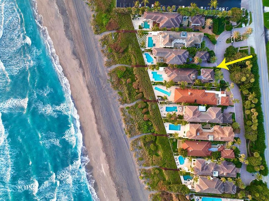 Located directly on the beach overlooking the Atlantic Ocean, the elegant oceanfront community is between Jupiter Island & Palm Beach in the quaint seaside town of Juno Beach. Close to Worth Avenue, championship golf & the Intracoastal Waterway this private enclave of 10 waterfront homes is rarely available.  The prestigious gated community of 700 Ocean Drive offers full time concierge services & security staff. Direct oceanfront courtyard home with fountain, pool & spa, is one story with a large master suite overlooking the ocean with his & her master baths, closets & dressing area. The open floor plan with living room, dining room & full bar allow for entertaining at its finest. Detached guest house has 2 bedrooms, kitchenette, living area and 2 car garage.