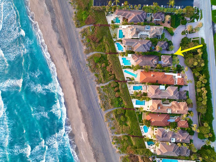 Located directly on the beach overlooking the Atlantic Ocean, the elegant oceanfront community is between Jupiter Island & Palm Beach in the quaint seaside town of Juno Beach. Close to Worth Avenue, championship golf & the Intracoastal Waterway this private enclave of 10 waterfront homes is rarely available.  The prestigious gated community of 700 Ocean Drive offers full time concierge services & security staff. Direct oceanfront courtyard home with fountain, pool & spa, is one story with a large master suite overlooking the ocean with his & her master baths, closets & dressing area. The open floor plan with living room, dining room & full bar allow for entertaining at its finest. Detached guest house has 2 bedrooms, kitchenette, living area and 2 car garage.