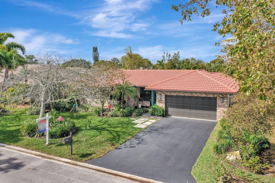 Beautiful 4/2 pool home on quiet cul-de-sac, offering perfect blend of style & functionality. Fully updated kitchen: open layout w/large center island, granite countertops, SS appliances, oversized double-door refrigerator, sleek oven w/vent hood & ample cabinetry. Tile throughout living area & new wood-like tile in bedrooms. Custom wet bar w/led lighting & ice fridge. Spa-inspired primary suite: stylish backsplash, designer vanity, led mirrors & seamless glass walk-in shower. Second bath updated: modern tile flooring, shower/tub combo & double-sink vanity. Travertine tile paved patio, resurfaced pool, stylish pergola & fruit trees creating outdoor retreat. Fully hurricane protected! Modern upgrades, thoughtful design & meticulous care make this home turnkey ready. Newer pool heater!