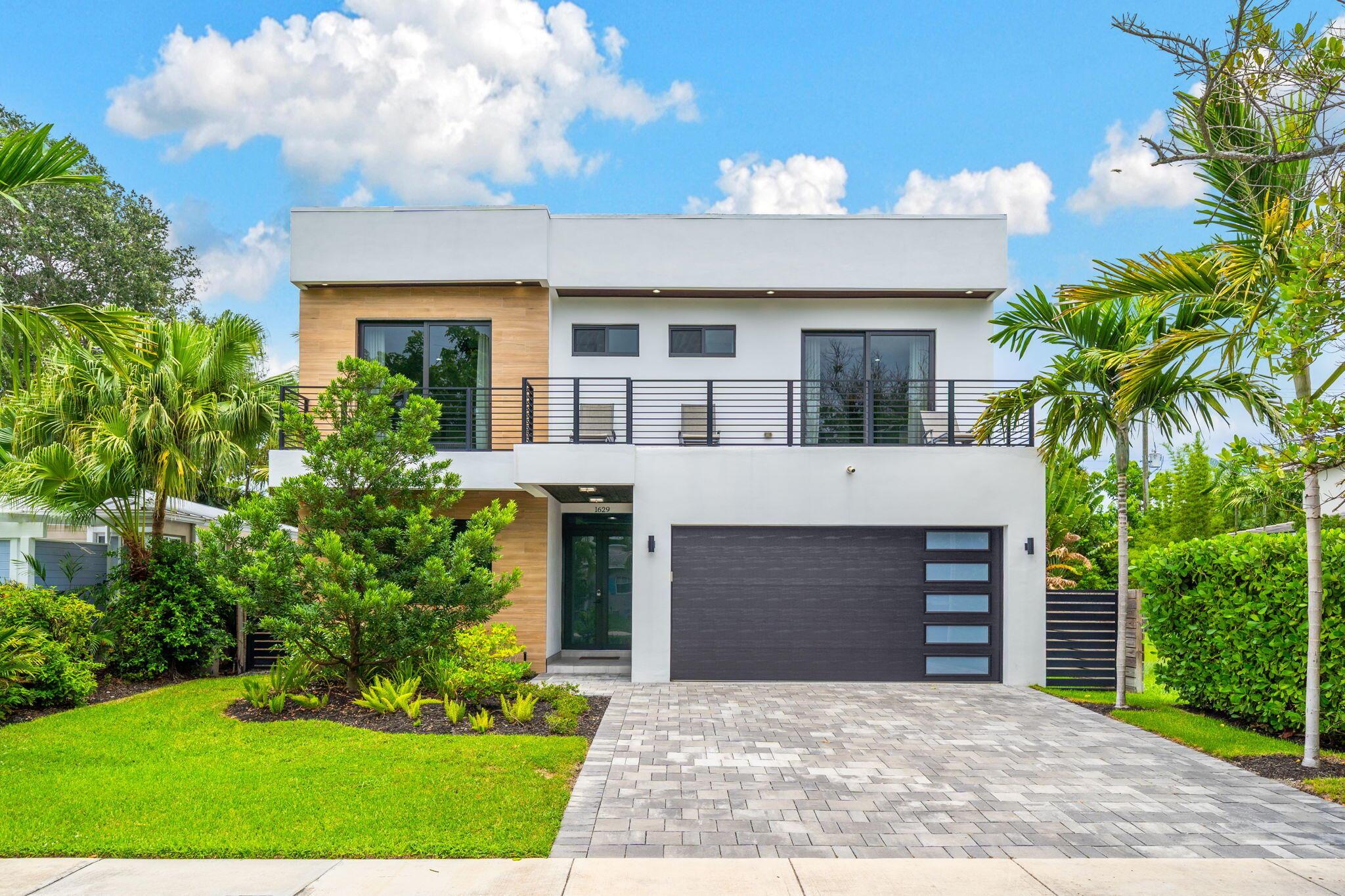 Located in the heart of Victoria Park, this like-new 2023-built luxury pool home offers 4 bedrooms, 5 bathrooms, and 2,871 sq ft of refined living space. The modern two-story design features warm wood accents, neutral and wood-look tile flooring, and all-impact glass windows and doors. A sleek custom kitchen shines with quartz countertops showcasing dramatic movement, gloss cabinetry, gas cooktop, and a full suite of top-tier built-in appliances. Smart home upgrades include security cameras, an alarm system, automatic blinds, and a whole-house water filtration system. The spacious primary suite boasts a private balcony, dual vanities, a soaking tub, and a large walk-in shower with body sprayers and a linear drain. Enjoy a versatile loft TV area and a covered patio with tongue-and-groove
