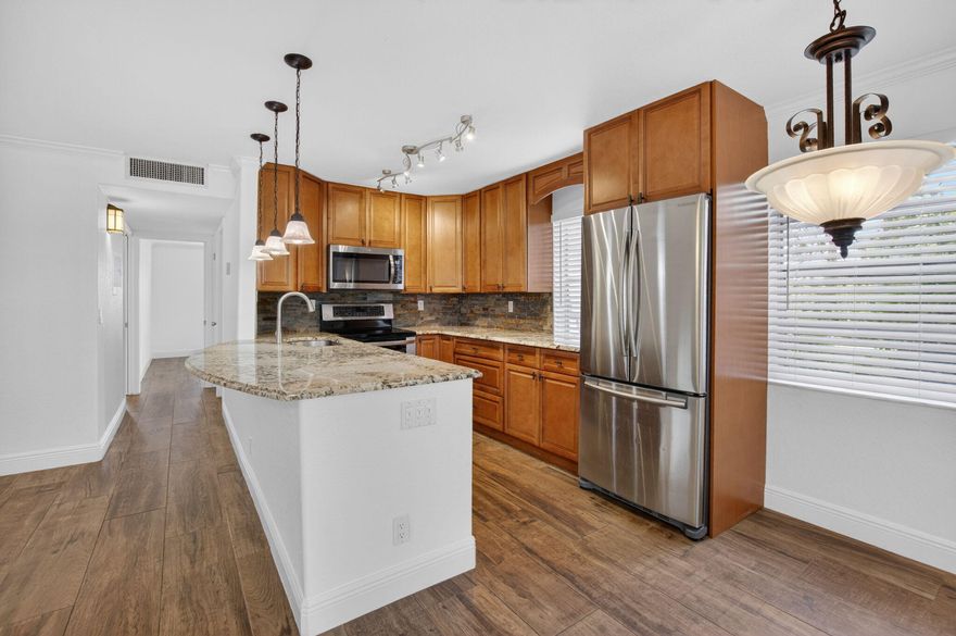 BEAUTIFUL 2 BEDROOM UNIT WITH GORGEOUS WOOD LOOK CERAMIC FLOOR!  EXPANDED MASTER EN SUITE BATHROOM,  HIGH END UPGRADES WITH LARGE KITCHEN COUNTER IN THE OPEN CONCEPT KITCHE !  FULLY ENCLOSED PATIO THAT OVERLOOKS A GRASSY AREA AND THE BUILDING IS ON A CUL-DE-SAC STYLE END SO THERE IS NO THROUGH TRAFFIC!   SERENE AND BEAUTIFUL!  COME SEE THIS ONE.
