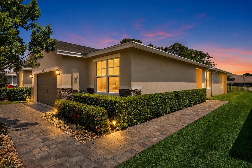 Stunning golf course-front 2-bedroom, 2-bathroom plus den residence located in the charming gated community of Canopy Cove. This immaculate home showcases elegant faux wood tile flooring throughout and a beautifully renovated kitchen featuring quartz countertops, custom cabinetry, new appliances, and a convenient breakfast bar. The spacious living area is highlighted by a striking accent wall with fireplace and flows seamlessly into the dining area, complete with an upgraded light fixture. A desirable split floor plan provides privacy, with a generously sized primary suite offering a walk-in closet and a well-appointed en-suite bath with dual sinks and a private water closet. Additional features include a large laundry room conveniently located near the garage, as well as a functional.... mudroom area. Outdoor living is equally impressive, with a covered patio perfect for enjoying serene golf course and lake views. Recent updates include kitchen appliances (2022), washer and dryer (2026), as well as impact windows and roof 2019.