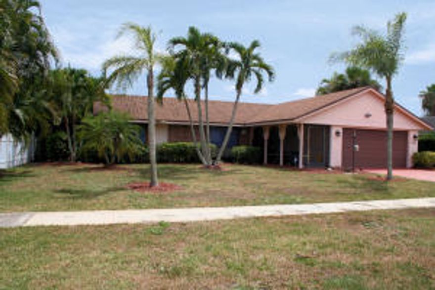 Great pool home in the heart of Wellington.  Solid wood parquet flooring in bedrooms and dining room, tile throughout the rest of the home. Updated kitchen. Clean, well cared for home. Spacious home feels larger than tax roles indicate.  Fenced yard. Lawn needs some TLC.  Sprinkler system currently not working.