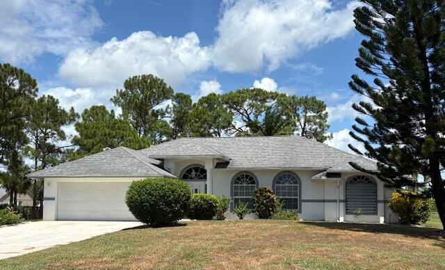 Location, Location, Location ! Pristine and well kept 3/2/2 on first lot from paved Coconut. Excellent elevation. Eat-in kitchen with bay window, breakfast bar, large pantry, and hi hat lighting. Large Formal DR. Master suite includes huge walk in and linen closets, dual sinks, roman tub, and separate shower. This home boasts large split bedrooms, vaulted ceilings, 18'' tile in most living areas. Roof replaced 2018. AC 2020. Water heater 2024. Water purification system serviced 6/2025.Sale includes large riding lawn mower. Pond at rear of property. Well kept yard. Long and wide driveway,