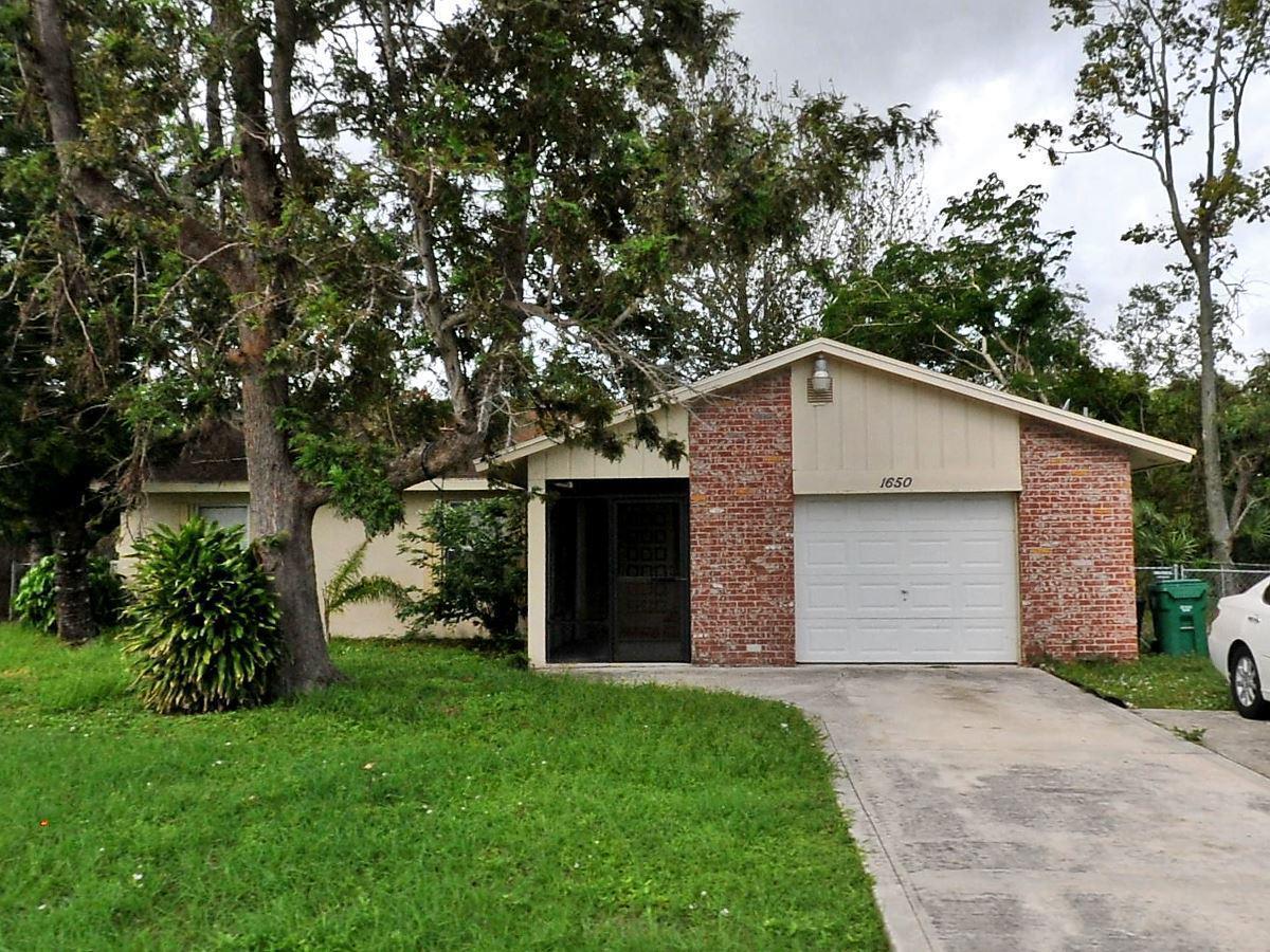 Located East of Floresta, Newly painted interior and exterior will be painted by the end of June.Kitchen redone a few years ago , new dishwasher being installed, spacious Florida room ( not included in living area sq ft) plus a fenced yard.