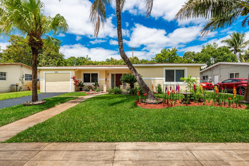Photo of 3685 NW 43rd Place, Lauderdale Lakes, FL 33309 (MLS # B26018296)