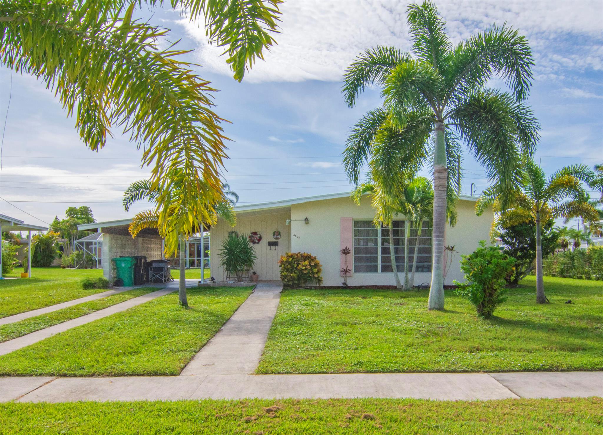 A Little Charmer in Sandpiper! 2 bedroom, 1 bathroom, CBS Home! Spacious Kitchen with Breakfast Bar for extra seating. Tile Throughout the Living room, Dining and Kitchen. Carpet in the Bedrooms. Laundry Room Located Inside. Nice Large Carport to Shade your car from the Florida Sun or Screen it in to add a nice Outdoor Living Area.Large Work Shed in the back with Electric!