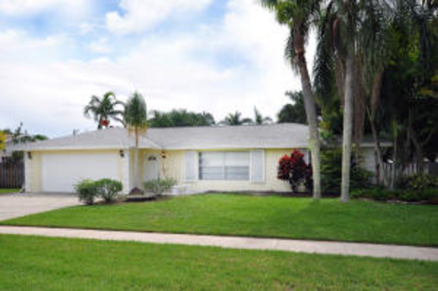 Beautiful 3/2/2 large fenced back yard with mature landscape. Freshly painted inside and out and newly updated. Nice marble counters in bathroom and kitchen. Tile floors and wood laminate in bedrooms. Great screened backyard patio with serving window from the kitchen makes outdoor entertaining a breeze! Great neighborhood and great schools, this house won't last!