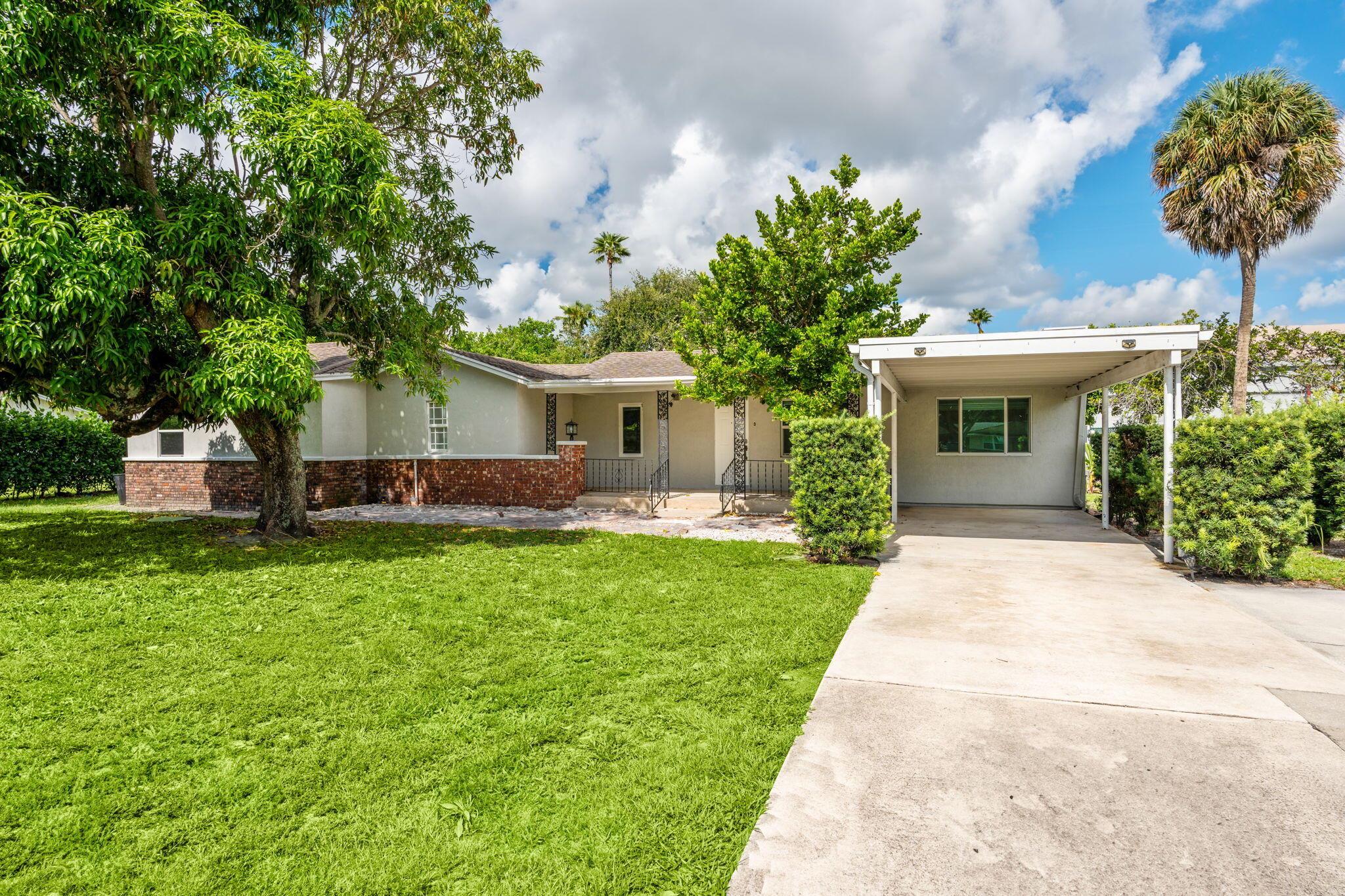 Perfectly located minutes from I‑95, this updated 3-bed, 3-bath home with a spacious den/office sits on an oversized 0.34-acre lot in central Palm Beach Gardens. Recent upgrades include a new A/C (2024), hurricane impact windows, fresh stucco, fresh interior paint, new septic system, updated water heater, washer, and dryer, and a just-installed, high-quality back fence. Inside, enjoy wood-look tile flooring, granite countertops, and wood cabinetry. With no HOA and close to top-rated schools, beaches, shopping, and dining, this home offers comfort, privacy, and unbeatable convenience.Disclaimer: Photos virtually staged; some items/features, including pool, are for illustration only and may not exist or be included. All room measurements are approximate; buyer to verify for accuracy.