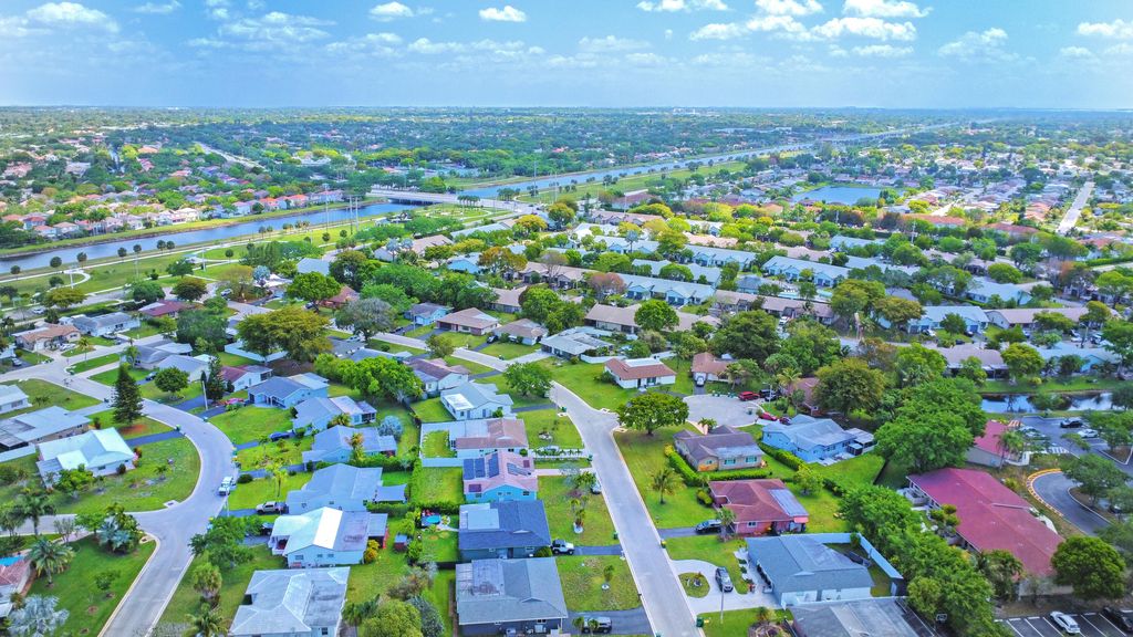 Photo of 8202 NW 100th Drive, Tamarac, FL 33321 (MLS # B26019613)