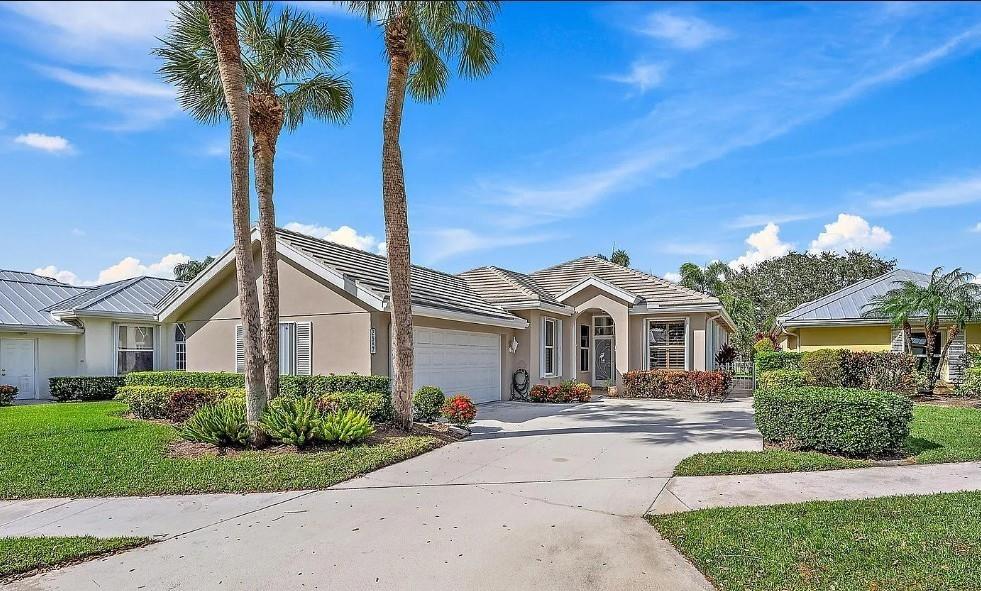 Welcome to 2687 SW Greenwich Way, nestled in the gated Meadows community of Palm City, FL. This beautifully remodeled lakefront home offers 3 bedrooms, 2 bathrooms, and 1,952 sq ft of stylish living space on a 7,970 sq ft lot. Step inside to discover a granite eat-in kitchen with stainless steel appliances that flows seamlessly into the dining and living areas. The spacious family room overlooks a fenced backyard with tranquil water views—perfect for relaxing or entertaining. The large master suite features updated granite counter with tile floors, walk-in closet, and a luxurious safe-step tub with separate tiled shower.