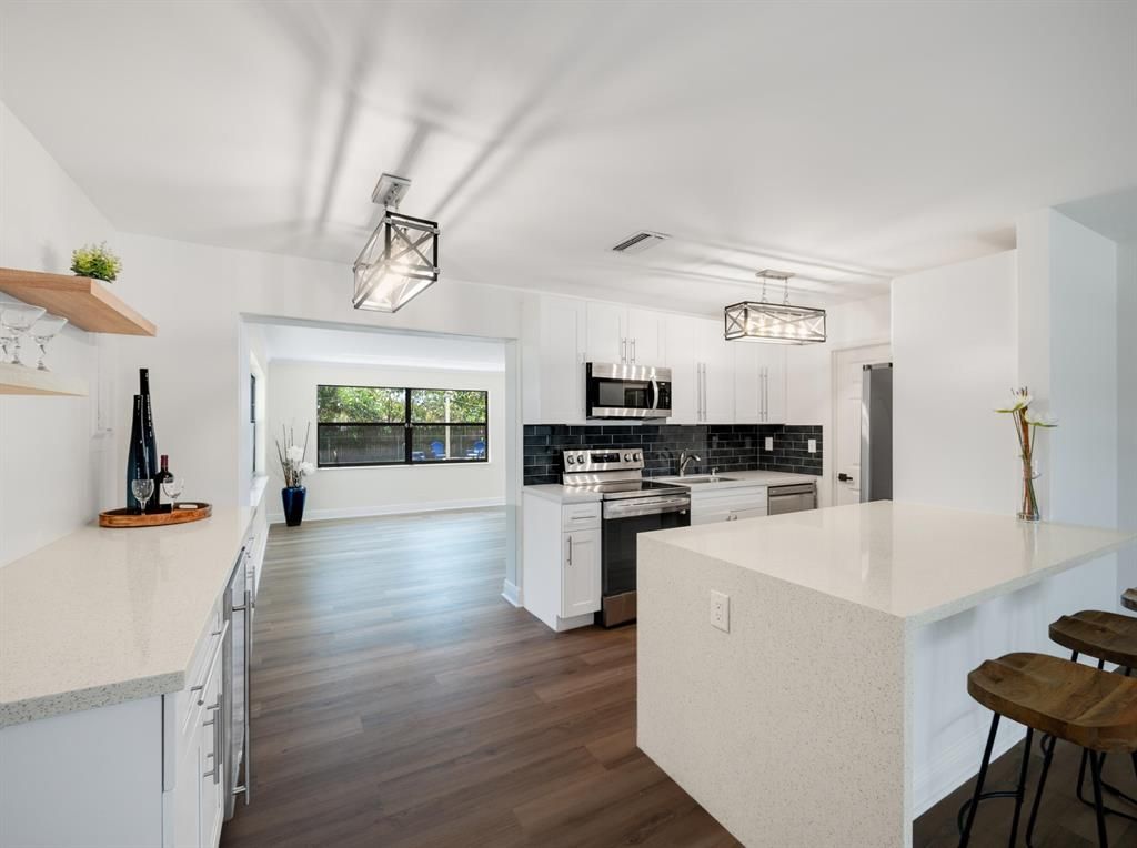 Photo of 912 W Jasmine Drive, Lake Park, FL 33403 (MLS # R10873799)