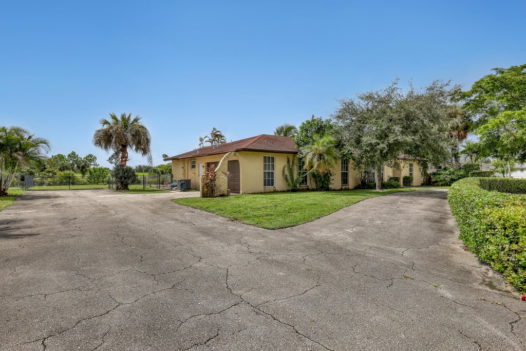 Photo of 110 MEADOWLARK Drive, Royal Palm Beach, FL 33411 (MLS # B26083853)