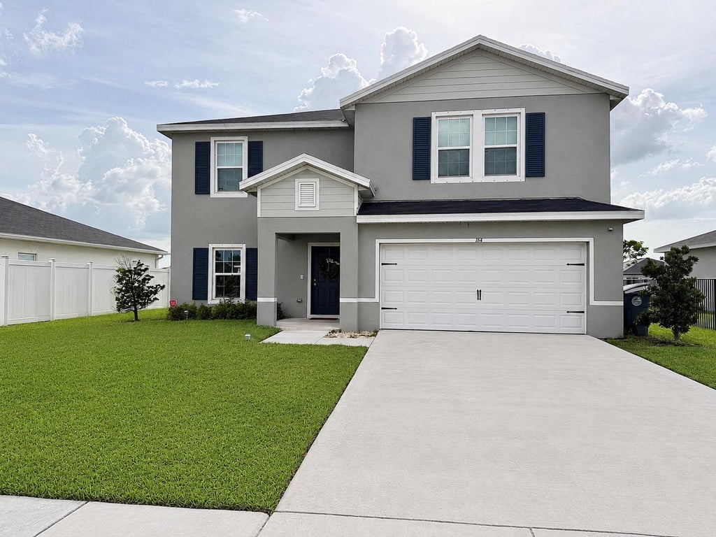 Photo of 164 NE DABOU Loop, Belle Glade, FL 33430 (MLS # B26054185)