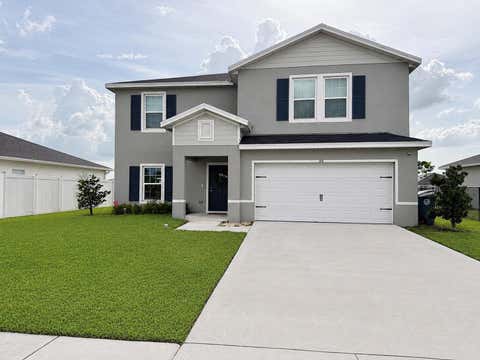 Photo of 164 NE DABOU Loop, Belle Glade, FL 33430 (MLS # B26054185)