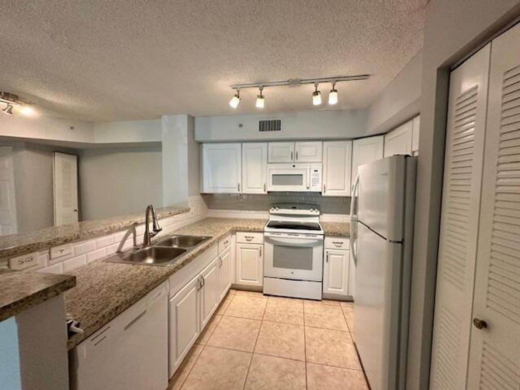 Photo of 7888 Sonoma Springs Circle #105, Lake Worth, FL 33463 (MLS # B26026586)