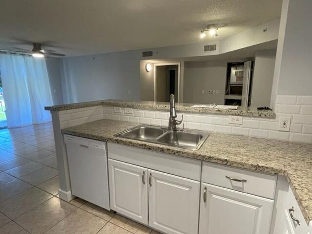 Photo of 7888 Sonoma Springs Circle #105, Lake Worth, FL 33463 (MLS # B26026586)