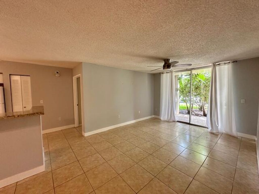 Photo of 7888 Sonoma Springs Circle #105, Lake Worth, FL 33463 (MLS # B26026586)
