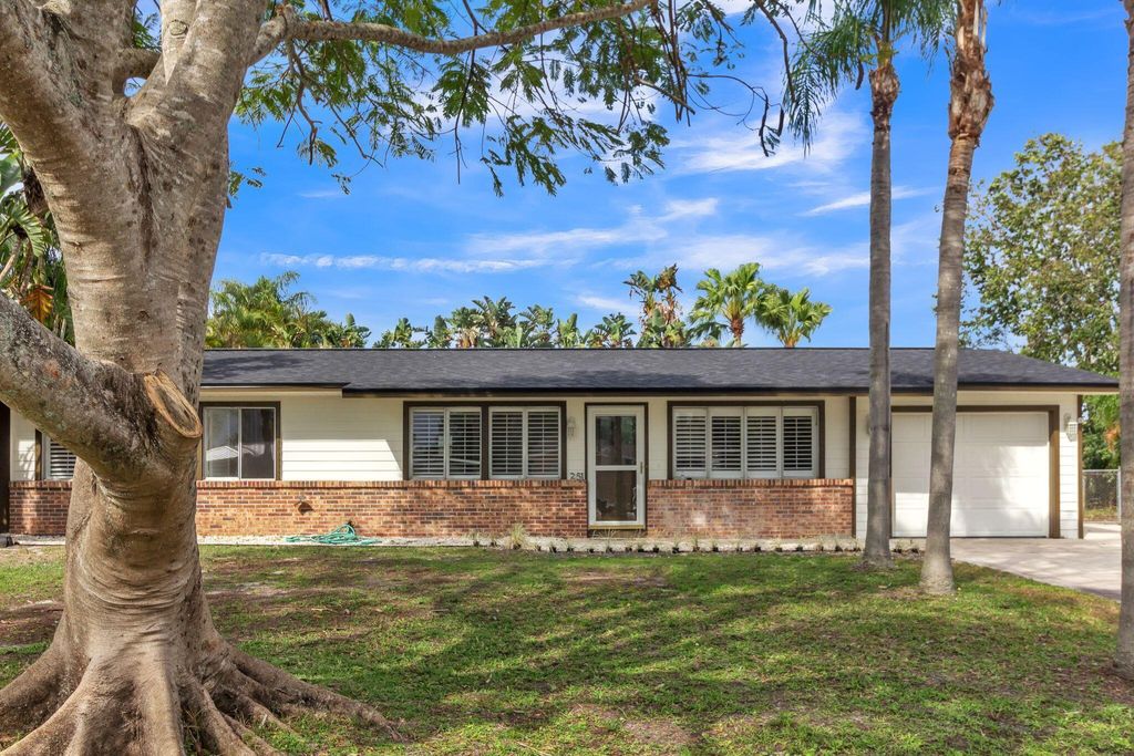 Photo of 251 NE Faring Avenue, Port Saint Lucie, FL 34953 (MLS # R10966319)