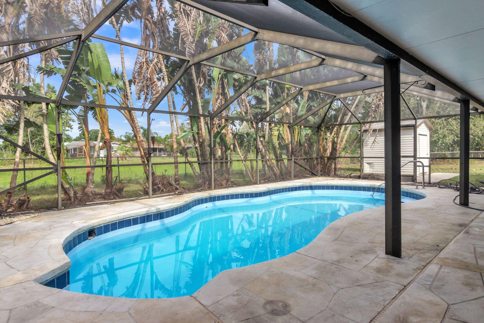 Fully remodeled in 2024 Port St Lucie Pool Home! Completely move in ready. Offering new quartz kitchen with shaker cabinets and high end finishes, new tile bathrooms with high end vanities, luxury vinyl floors, fresh paint in and out, new fixtures and landscaping. Easy access to i95 and shopping. Move in ready condition, you wont need to lift a finger. No HOA!! 2024 AC Unit, 2024 Roof. Come relax in this gorgeous pool and live your Florida Dream! Use Showing time to book.