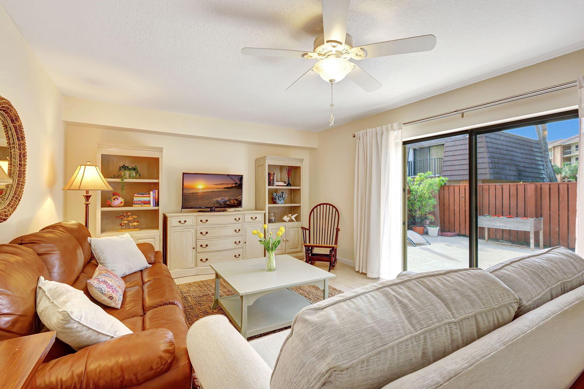 Experience the best of Jupiter's beachside lifestyle in this beautifully appointed 2 bedroom, 2.5 bath townhome available for annual or seasonal lease with immediate occupancy. Here, coastal charm meets everyday convenience, with a location less than one mile from Jupiter Beach, the Juno Pier & Bluffs Square Shoppes. This fully furnished, turnkey home offers a light & inviting floor plan with an entry-level living, dining & kitchen area that wraps around a spacious private courtyard, creating seamless indoor-outdoor flow, perfect for relaxing, entertaining & enjoying the ocean breezes.The kitchen features quartz countertops and abundant natural light; and, a convenient half bath with laundry area completes the main level. Upstairs are two spacious bedrooms and two full baths.