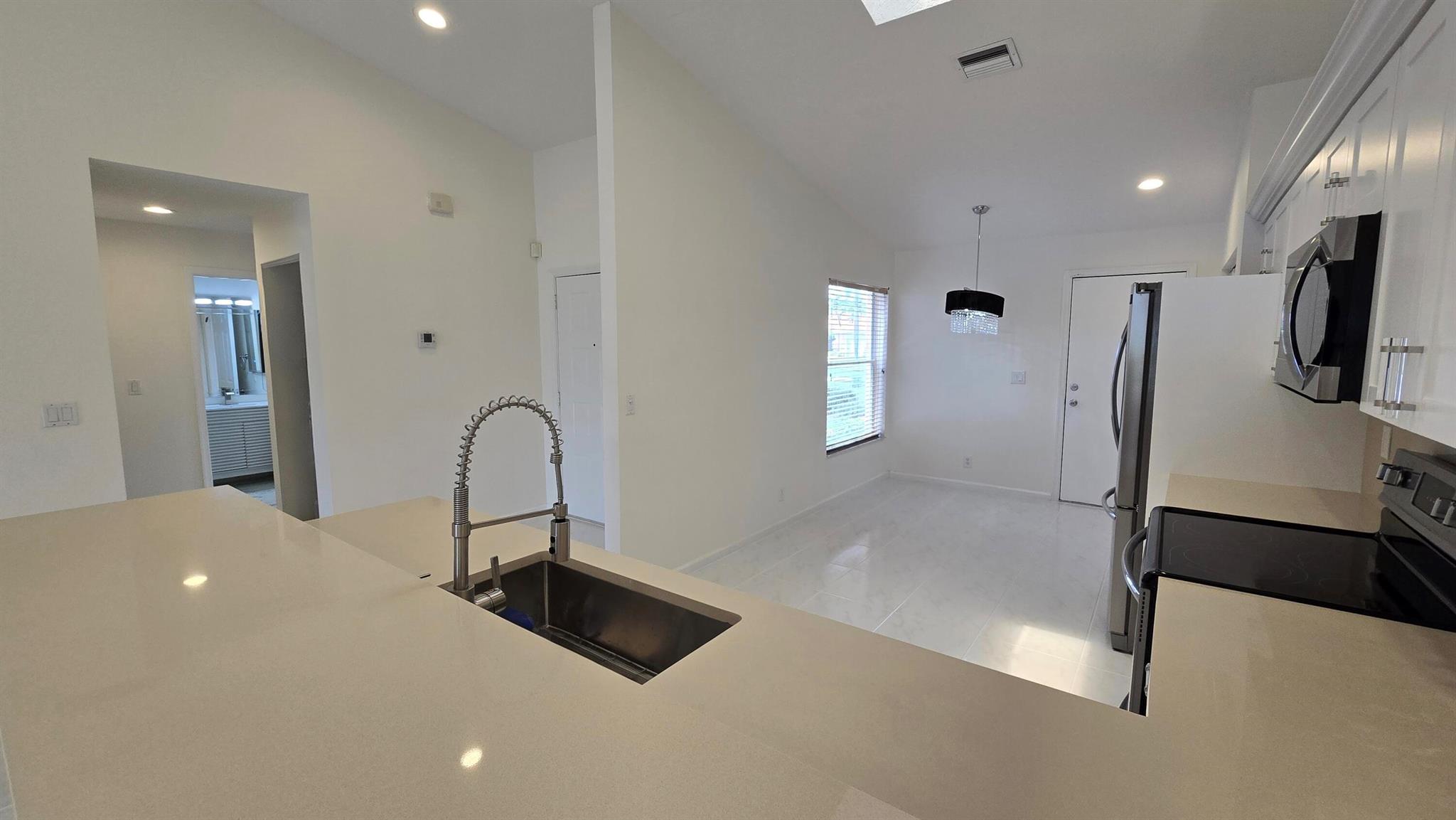 Beautifully renovated 3/2 villa available for annual lease in the desirable 55+ community of Coral Lakes. This bright, spacious home features white quartz countertops, brand new cabinets, and fully updated bathrooms with marble tile, new vanities, a spa-like shower, and a guest bath with tub. Residents enjoy a 72,000 sq ft clubhouse with indoor and outdoor pools, fitness center, theater, cafe, tennis, pickleball, and endless activities. Conveniently close to shopping, dining, golf, and beaches--resort-style living with no membership fees!