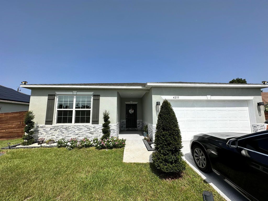 Photo of 4233 SW Yalta Street, Port St Lucie, FL 34953 (MLS # R10906749)