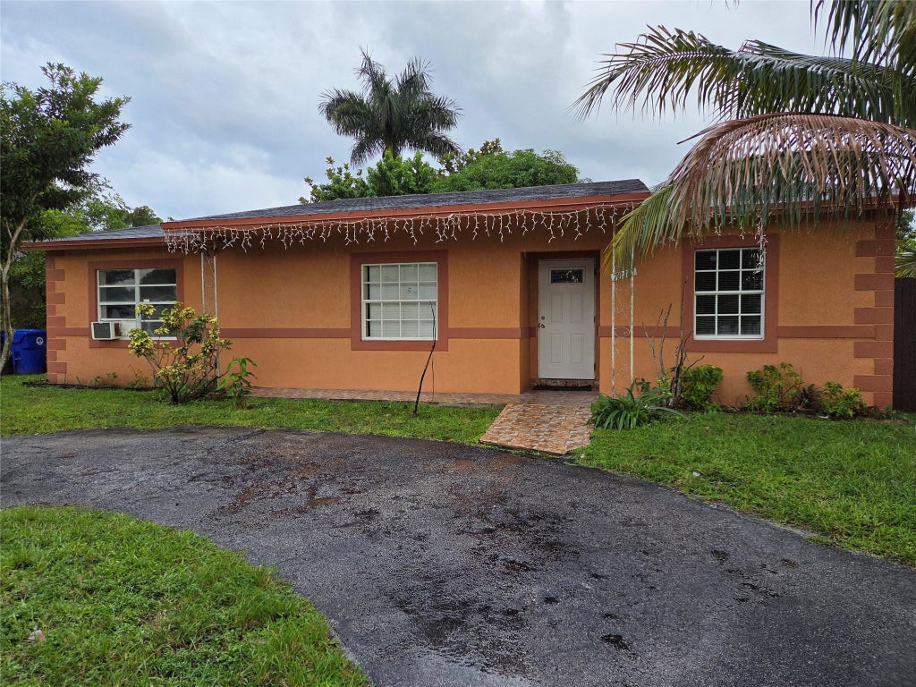 Photo of 7818 SW 7TH Court, North Lauderdale, FL 33068 (MLS # B26092381)