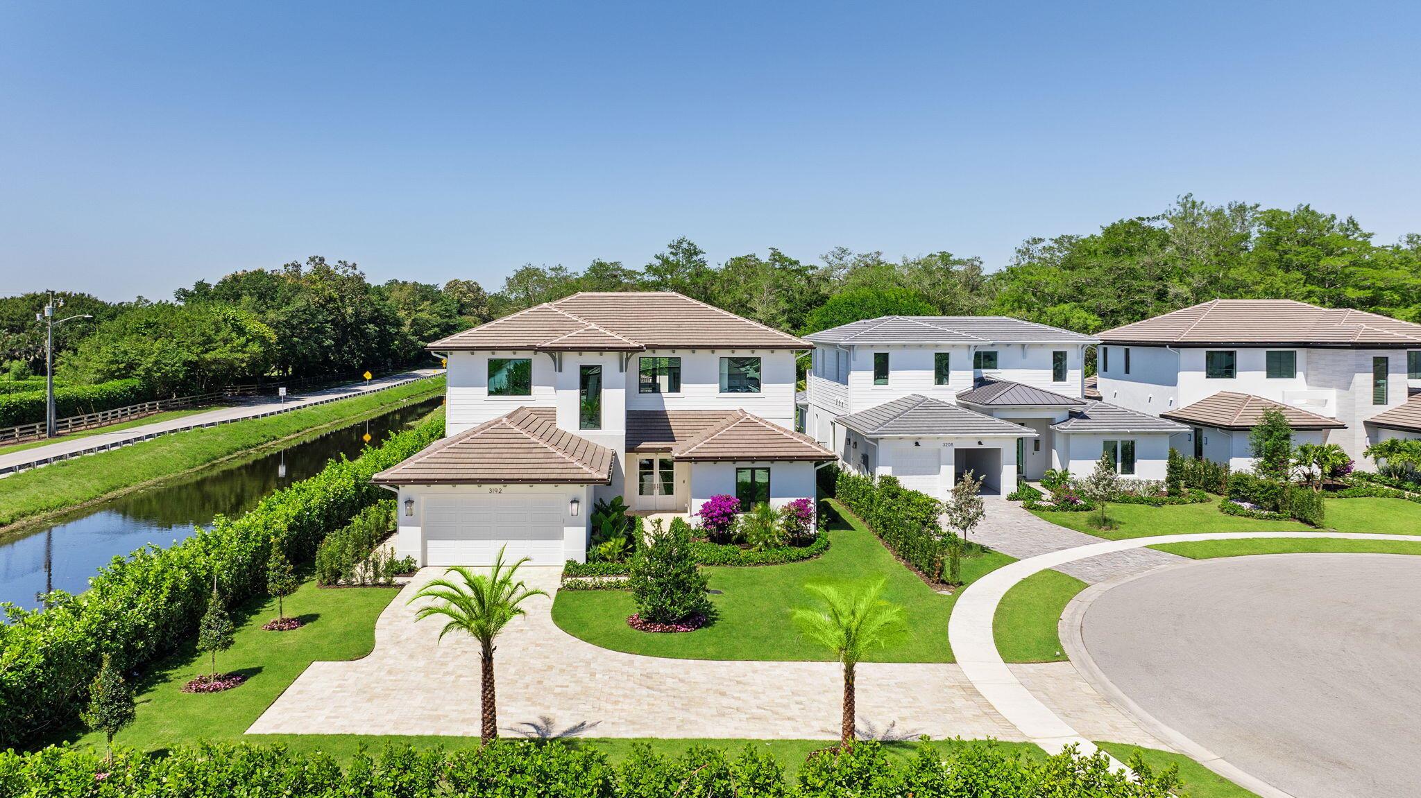 Discover elevated living in this custom-built estate located in the prestigious Palm Beach Polo community. This 5-bedroom, 5.5-bath masterpiece blends timeless design with modern luxury, featuring soaring 12' ceilings, expansive impact windows, and an open layout bathed in natural light. A chef's kitchen showcases Sub-Zero and Wolf appliances, a large island, and flows seamlessly to a resort-style outdoor oasis with pool, spa, summer kitchen, and custom landscaping. Each bedroom offers a private en-suite, with custom closets throughout. A club room, dual laundry rooms, automated lighting, integrated sound, and exquisite finishes complete this exceptional home on an oversized lot in one of Wellington's most exclusive enclaves.