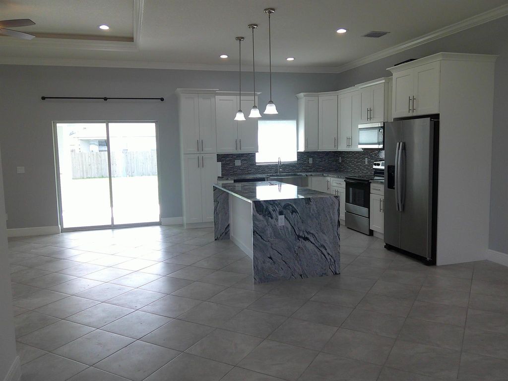 Photo of 310 SW Becker Road, Port Saint Lucie, FL 34953 (MLS # R11030394)