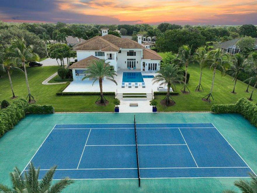 Experience the Palm Beach lifestyle in Wellington. This resort-style estate on 2 acres is a rare opportunity for those who value luxury, space, and proximity to the horse show - just a short golf cart ride away.
Remodeled by Triple Crown Group, this spectacular property is designed for both refined living and effortless entertaining. The home features 6 bedrooms, 2 beautifully appointed kitchens, expansive indoor living spaces, and seamless transitions to the outdoors. The estate's professionally surfaced tennis court, private pool and hot tub, and fully equipped outdoor kitchen and grill area create the ultimate resort-at-home experience. Direct access to the riding trail through the private back gate makes this a dream for equestrians, while the fully fenced grounds offer safety and privacy for kids and pets alike.
A rare combination of elegant design, high-end amenities, and lifestyle-focused features - all nestled in the heart of Wellington.

DISCLAIMER: All information provided to you regarding this Property by listing agent and her associates has been obtained from third parties such as the Multiple Listing Service, public records and other sources. All Buyers should independently verify all information provided regarding this Property. The Seller, listing agent and broker make no representation as to the accuracy of this information. The Seller, Realtor and Listing broker make no representation as to the accuracy of this information.