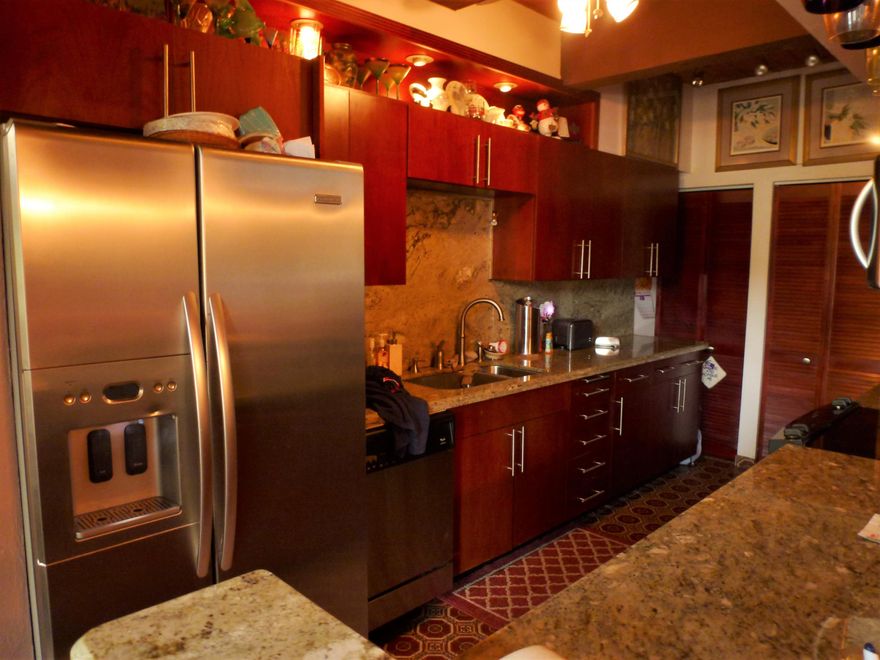 Rarely available three bedroom townhouse on the golf course in Majestic View! This spacious unit offers walls of glass, volume ceilings and custom mirrors. You will love to cook in this gourmet chef's kitchen with stainless steel appliances, granite counters and a built-in snack bar. The kitchen opens to the living area for today's modern lifestyle. There is a bedroom and full bathroom on the first floor-perfect for guests. Romantic master bedroom includes a private screened-in balcony with golf course views. Relax all day long on the oversized screened-in back patio. Enjoy the community clubhouse, pool and tennis.New roof coming in 2017! Fantastic location-convenient to commuter roads, University, Las Olas and so much more!Special assessment for new roof in 2017-$168 a month for 10 years.