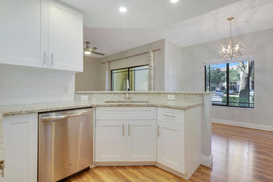 Open & bright first floor unit, laminate flooring, updated kitchen with white cabinets and granite countertops. Well maintained & ready for you to call it home! San Matera is a gated community with all the amenities you can imagine, resort style pool, gym, tennis and more! Close to shopping & the highway for easy commuting access.