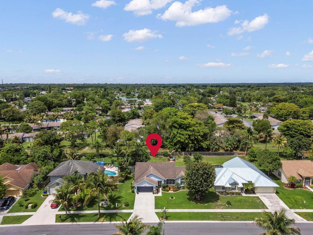 Photo of 118 Royal Pine Circle N, Royal Palm Beach, FL 33411 (MLS # B26025616)