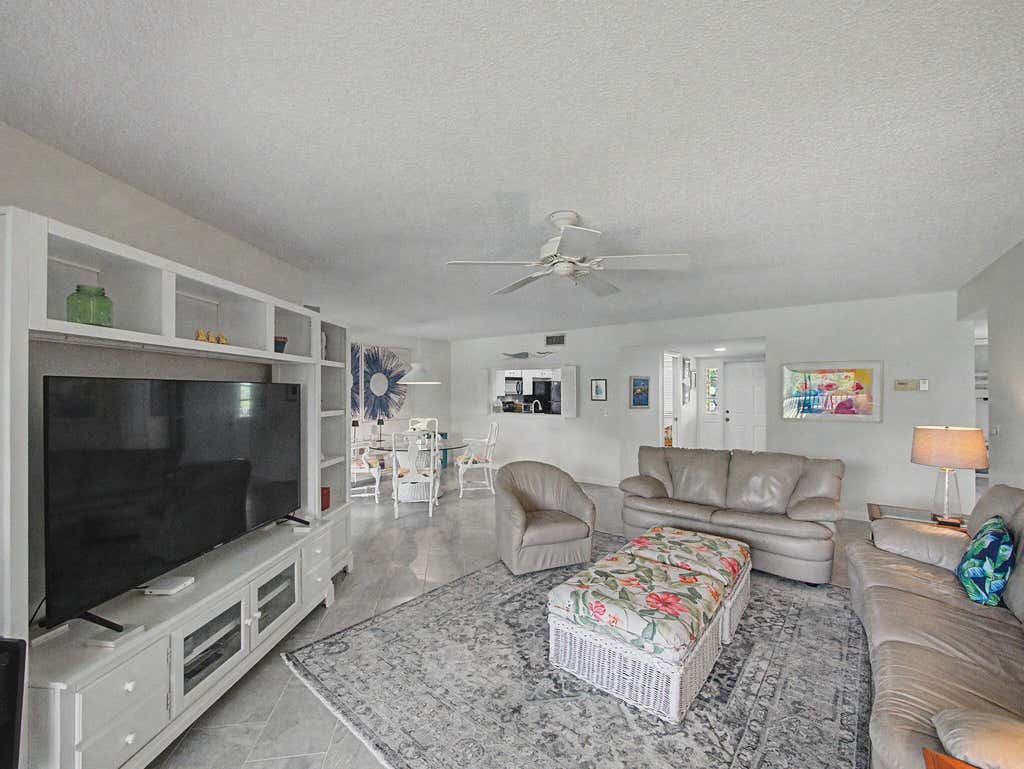 Photo of 5132 SE CLUB Way #202, Stuart, FL 34997 (MLS # B26059759)