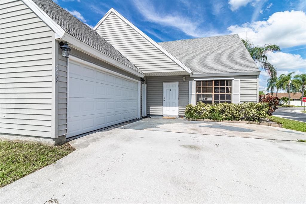 Photo of 6052 Lace Wood Circle Cir, Lake Worth, FL 33462 (MLS # R10810936)