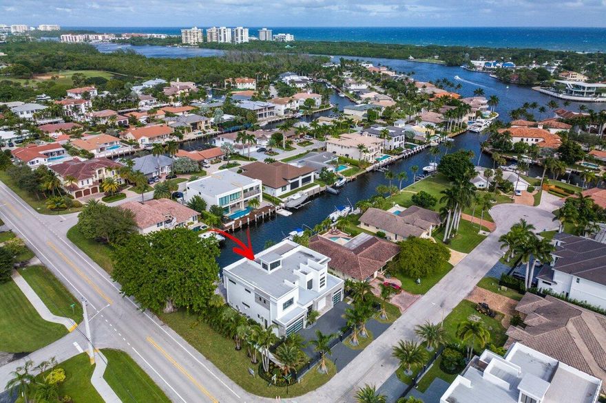 Just Completed! This new deep-water estate is spectacularly designed and beautifully finished. Truly the trifecta of east Boca located on ''Millionaires Row'' in the Golden Triangle, this home is short walk to Mizner Park, minutes to the Boca Resort, and a quick splash to Lake Boca by boat! Just above the loft a circular staircase accesses one of the only private roof decks in East Boca, a private escape from the everyday where you'll enjoy panoramic views of all Boca landmarks and the intracoastal waterway. Downstairs, a grand marble patio is surrounded by mature tropical landscaping, and features a heated saltwater pool with spa, covered and uncovered patio spaces, and a full summer kitchen. The fully gated estate has plenty of space for all your toys, a circular porcelain driveway leads to a three car garage with impact glass doors and commercial epoxy floors, behind the home is nearly 100 linear feet of private dock in an "L" configuration, perfect for a yacht, jet skis, kayaks and more. Truly a best of everything home, ready for immediate occupancy.