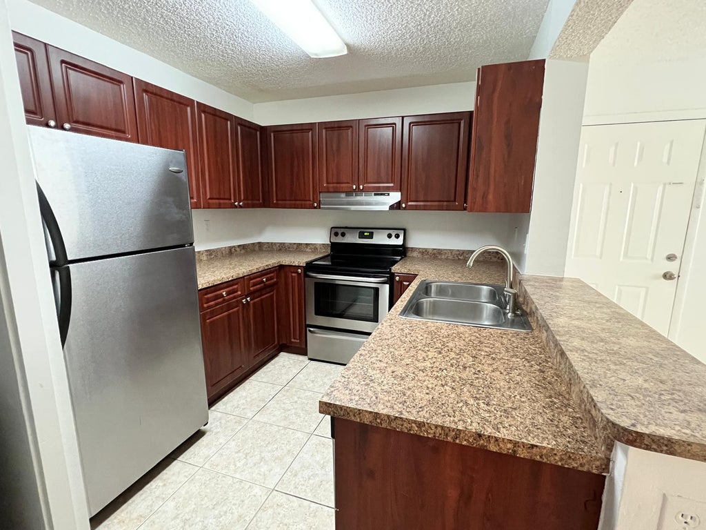 Photo of 351 PALM Way #204, Pembroke Pines, FL 33025 (MLS # B26057945)