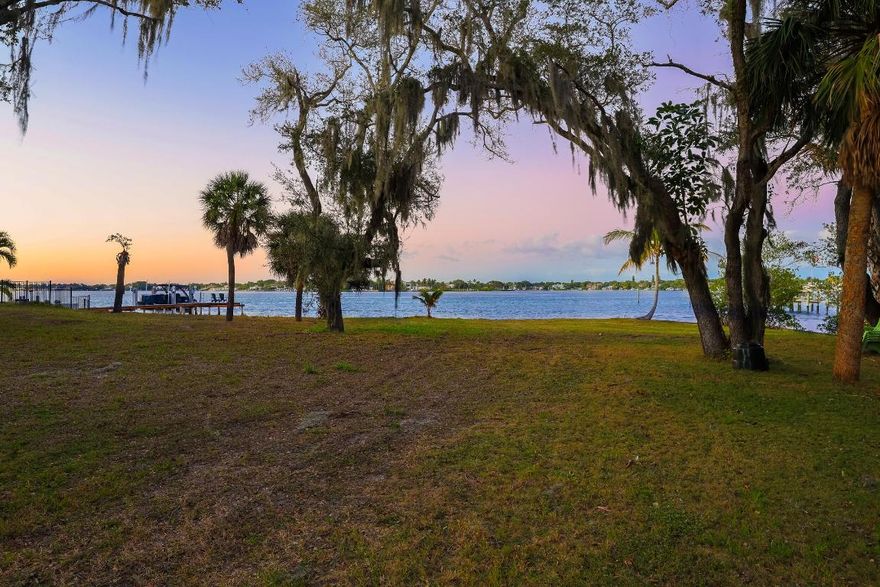 Truly unique and irreplaceable, this extraordinary 2.23-acre waterfront property sits on one of the widest parts of the Loxahatchee River, offering a once-in-a-lifetime opportunity to build a custom luxury dream estate in the heart of Jupiter. The property features approx. 150' of direct frontage on the Loxahatchee River, plus over 600' of frontage along a private canal and basin, creating exceptional water views, privacy, and design flexibility. The parcel includes a private cove with a one-of-a-kind boat/guesthouse constructed directly over the water, equipped with a 12,000-lb boat lift, lifting boat into the first level of the 3-level 2BR/2BA guesthouse. Extending from Center Street to the Loxahatchee River and including a privately owned road, the setting is remarkably secluded, nearly a quarter mile from the nearest public road, yet centrally located. Enjoy a two-mile boat ride to the Jupiter Inlet with quick access to the Gulf Stream for offshore fishing, and a short cruise to restaurants at Love Street and Harborside. Some of Palm Beach County's best beaches, I-95, and the Florida Turnpike are all within three miles.

Surrounded by natural beauty, the property is a true wildlife sanctuary, home to osprey, pelicans, herons, and occasional manatees and sea turtles. Formerly home for 60+ years to Jupiter pioneer Dodie Thayer (famed Lettuce Ware artisan), this fisherman's paradise represents a rare opportunity to create a legacy waterfront estate on one of Jupiter's most significant, iconic parcels.