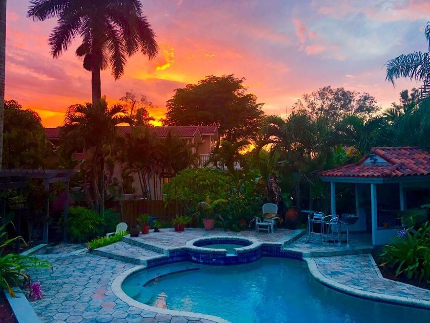 Nestled on a sprawling 1.25-acre lakefront lot in the prestigious, no-HOA equestrian heart of Davie, this magnificent 4-bedroom, 5-bathroom estate offers 3,923 sq. ft. of uncompromised luxury and privacy. Step inside to an open-concept layout flooded with natural light, featuring stunning marble flooring, a cozy fireplace, and a gourmet kitchen complete with granite countertops and stainless steel appliances. The massive 1,200 sq. ft. primary suite is a true sanctuary, boasting a private office, extensive closet space, a jacuzzi, a sauna, and direct access to a balcony overlooking serene water views. The upper level features 3 comfortable bedrooms, 2 full baths, a maid's room, and a spacious playroom/studio equipped with a separate entrance—offering endless potential for a home business. Nestled on a sprawling 1.25-acre lakefront lot in the prestigious, no-HOA equestrian heart of Davie, this magnificent 4-bedroom, 5-bathroom estate offers 3,923 sq. ft. of uncompromised luxury and privacy. Step inside to an open-concept layout flooded with natural light, featuring stunning marble flooring, a cozy fireplace, and a gourmet kitchen complete with granite countertops and stainless steel appliances. The massive 1,200 sq. ft. primary suite is a true sanctuary, boasting a private office, extensive closet space, a jacuzzi, a sauna, and direct access to a balcony overlooking serene water views. The upper level features 3 comfortable bedrooms, 2 full baths, a maid's room, and a spacious playroom/studio equipped with a separate entrance—offering endless potential for a home business, private gym, or guest suite. Outside, live the ultimate South Florida lifestyle with a private pool, spa, pool bar, and 150 feet of premium water frontage surrounded by lush tropical landscaping. Complete with a 4-car garage configuration and an expansive circular driveway. Capitalize on this rare, unrestricted property today!