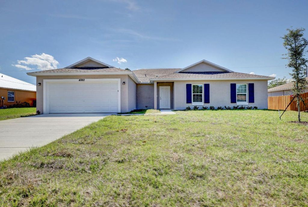 Photo of 1584 SW Hunnicut Avenue, Port Saint Lucie, FL 34953 (MLS # R10958587)