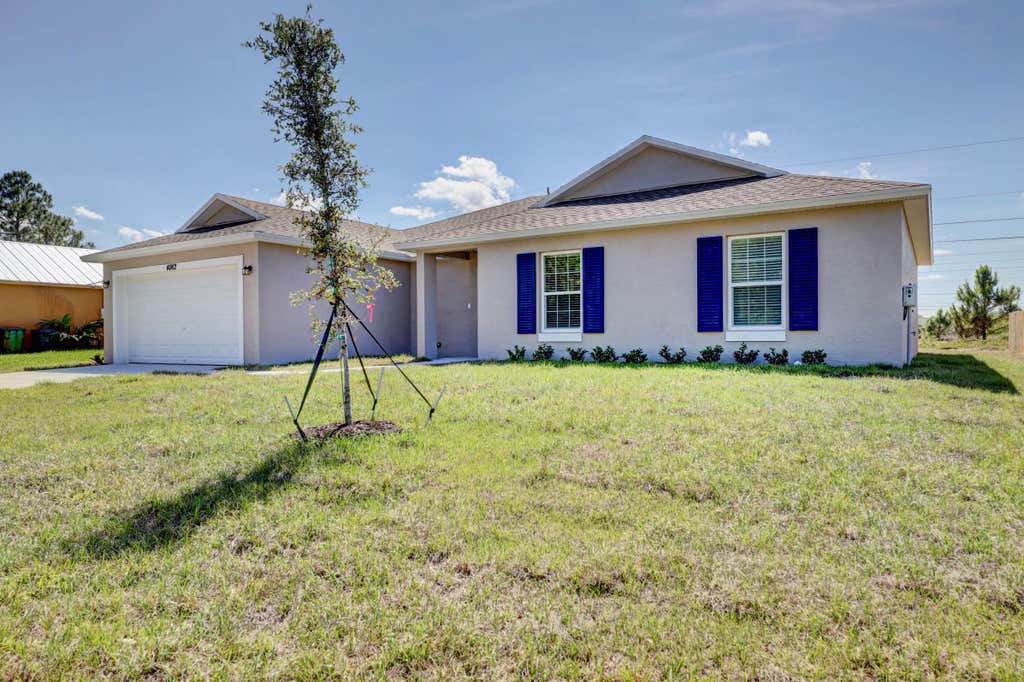 Photo of 1584 SW Hunnicut Avenue, Port Saint Lucie, FL 34953 (MLS # R10958587)