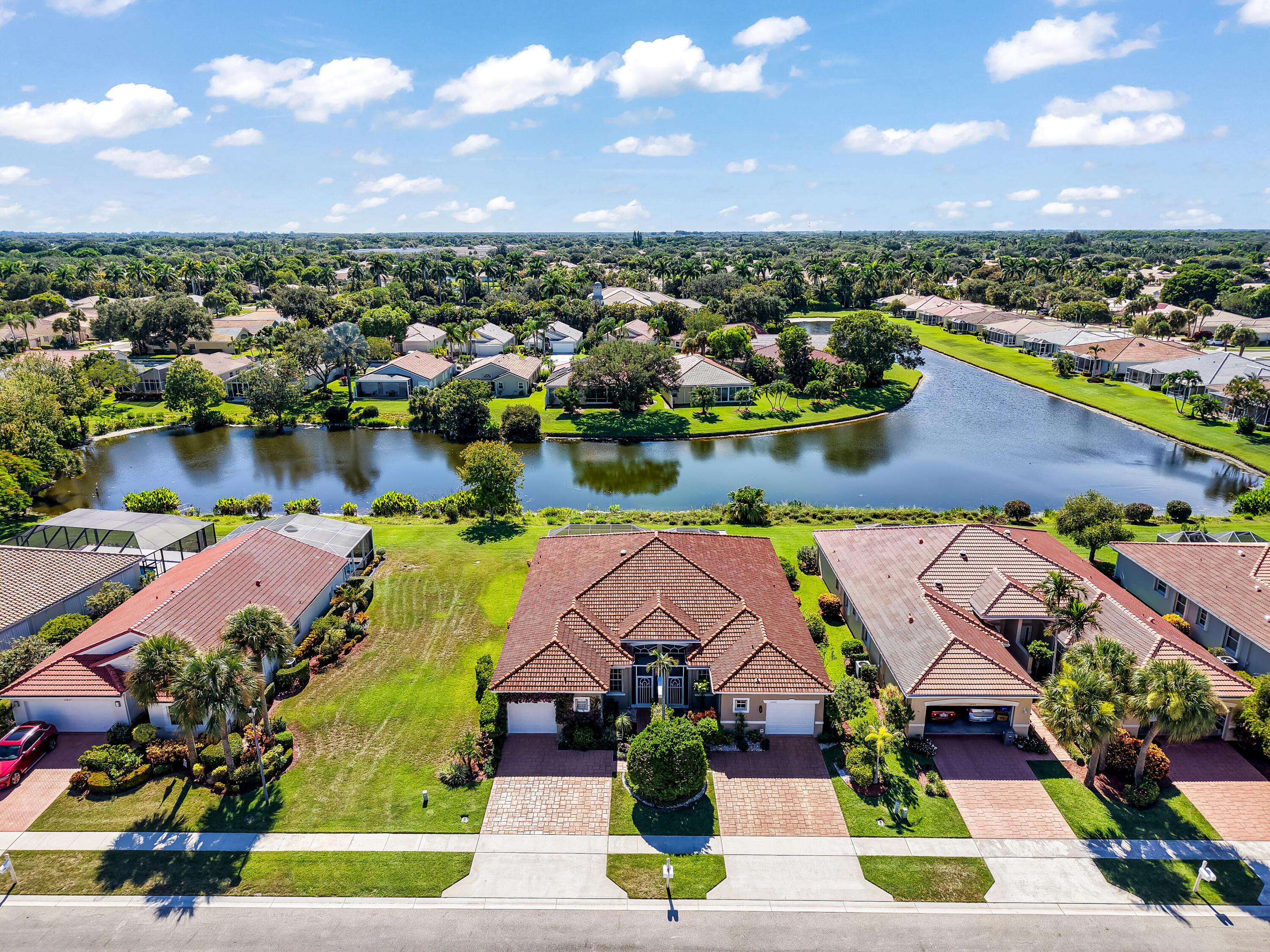 Stunning & totally renovated 3BD/2BA villa in the highly sought-after 55+ gated community of Majestic Isles in Boynton Beach! Largest Villa! From the moment you step inside, you'll appreciate the open concept layout, soaring ceilings, & natural light that fills the home. The chef's kitchen has been completely redesigned w/ quartz countertops, stainless steel appliances, custom cabinetry, under-cabinet LED lighting, pendant fixtures, & a spacious island perfect for entertaining. Both bathrooms have been luxuriously remodeled w/ designer finishes, while all three bedrooms feature custom-built closet organizers for maximum storage. Newer A/C (2 Year old Lennox) & new HWH. The master w/suite offers a spa-like retreat w/ a frameless glass shower, dual vanities, & a walk-in closet w/ built-ins.