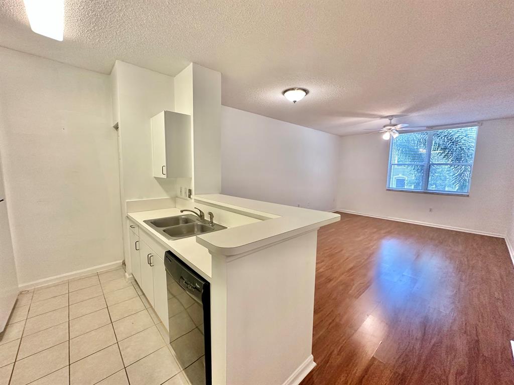 This amazing Condo is on the 1st Floor and has a spacious floor plan and is one you don't want to miss. With walk-in closest roman style tub and washer and dryer in the unit you're going to love it. Walkout your front door and in just minutes your only steps away from all the best entertainment and shopping Cityplace and Downtown West Palm Beach Clematis has to offer. The Courtyards offers a full time Concierge and Front Desk and is full of luscious landscaping, fountains and garden views. Enjoy Covered Parking. Call Today This One Will Not Last!!!