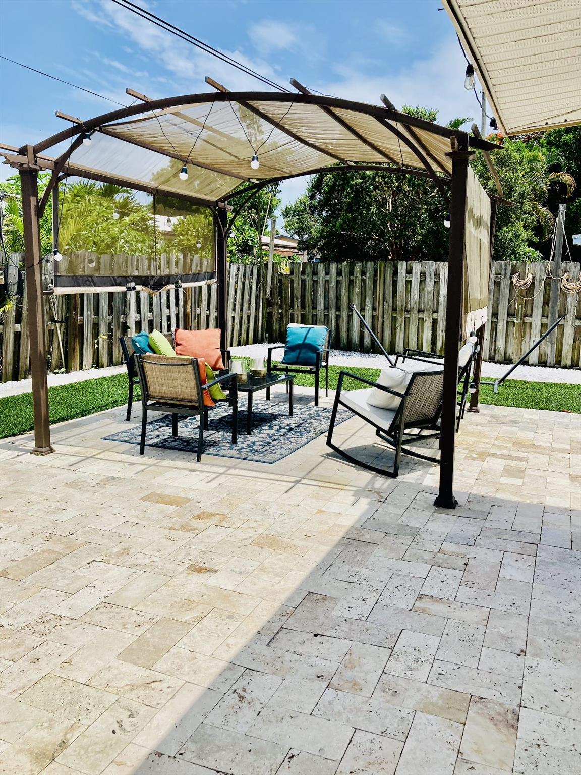 Fantastic 3-beds, 2.5-baths SFR with an attached private studio, available for annual or seasonal rent. The main house has been completely remodeled with a sophisticated touch, featuring light colors and tasteful decorations. It boasts numerous upgrades, including new plumbing, leveled floors without barriers, and new doors and portals. The Florida room is enclosed with AC, providing additional comfortable living space. Inside, you'll find newer appliances, new baths, and new tile floors throughout. A convenient laundry room is attached to the house. Parking is abundant in the front yard, and the backyard offers a charming canvas gazebo. The attached, furnished studio has its own private entrance and includes 1 bed, 1 bath, a microwave, 2 mini-fridges, a small patio, & dedicated parking.